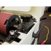 Close-up of a belt sander with a red sanding belt on the JET DDS_225-T Dual Drum Sander