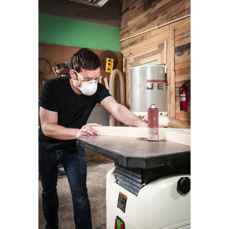 Person using a JET JOSS-S Oscillating Spindle Sander in a workshop
