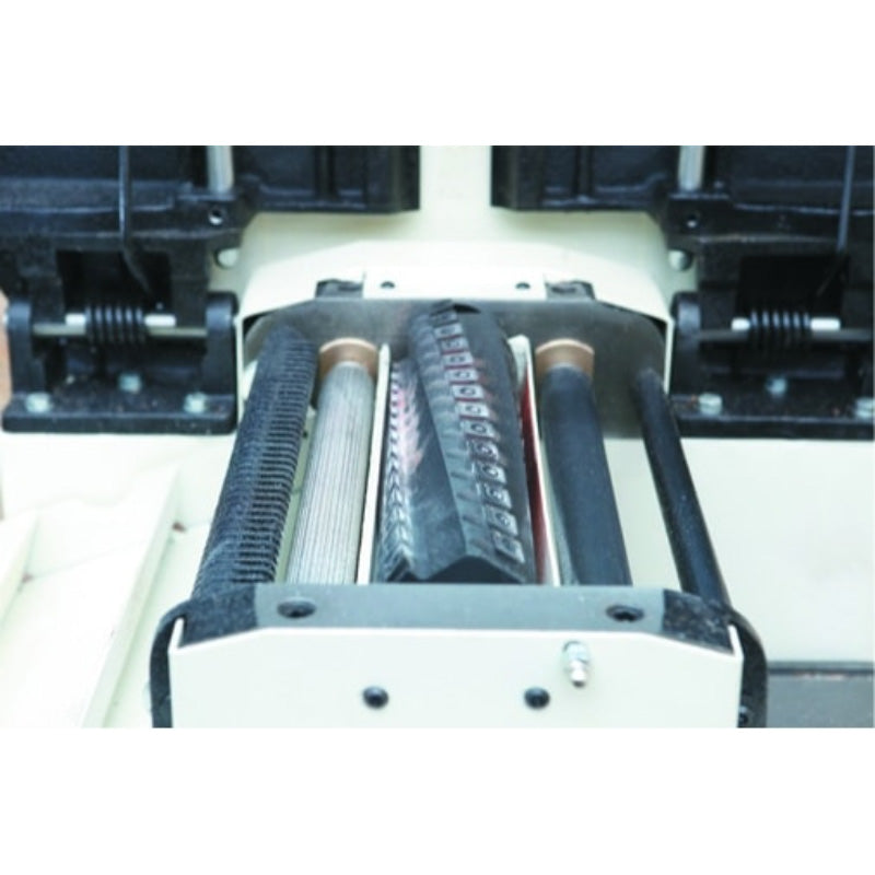 Close-up of a mechanical component with gears and belts on a JET JPT_410HH-T Helical Planer Thicknesses